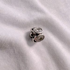 Authentic pandora 925 silver threaded core charm with crystal accents.